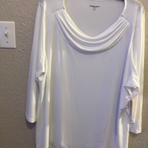 White top with silver hardware around the neck